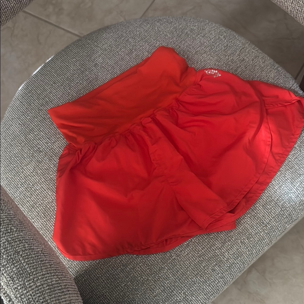 Free people movement bright orange shorts